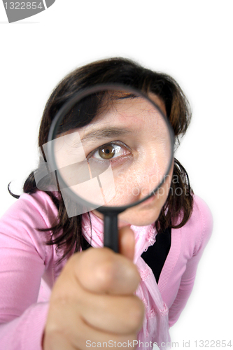 Image of Young businesswoman holding Magnifying Glass, business photo