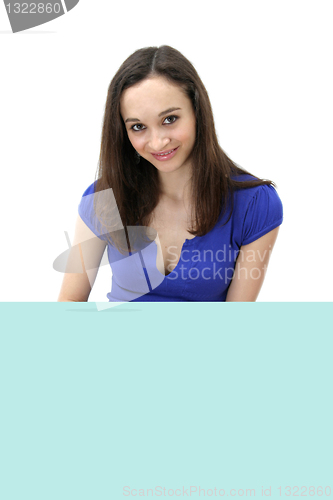 Image of Young woman holding blank board