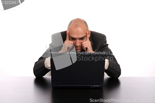 Image of businessman working on laptop