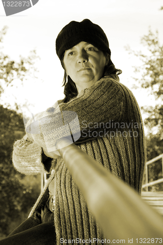 Image of  beautiful woman in an autumn park 