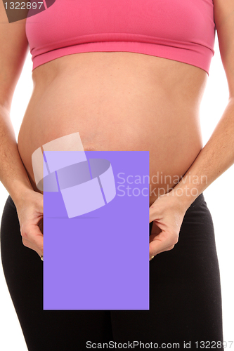 Image of beautiful pregnant woman with publicity board