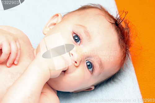 Image of sweet baby sleeping on a blanket, newborn baby