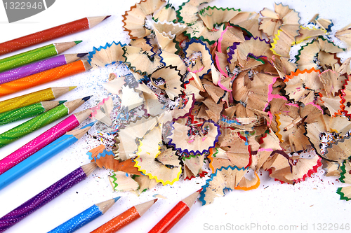 Image of Assortment of coloured pencils with shadow on white background