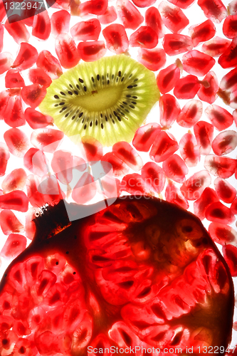 Image of beautiful and fresh pomegranate grains and kiwi