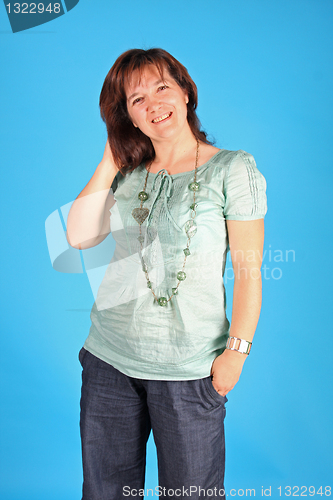 Image of fashion woman on blue background studio shot