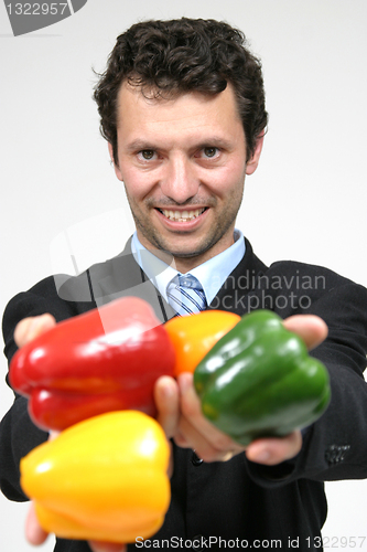 Image of man holding color peppers, healthy food photo