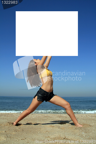 Image of A gorgeous model holding a blank sign in the air