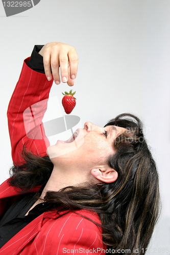 Image of beautiful woman with beautiful red strawberries, healthy food