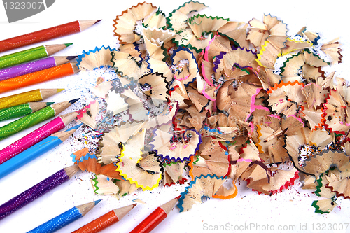 Image of Assortment of coloured pencils with shadow on white background