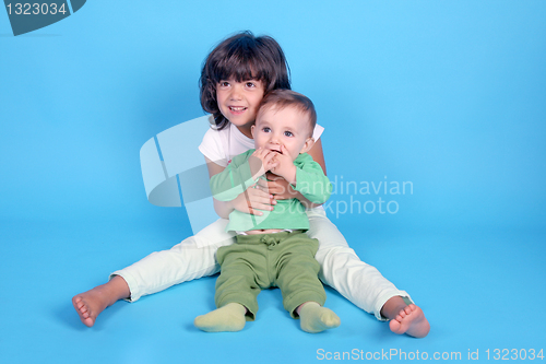 Image of beautiful girl with baby, cousins, family photo