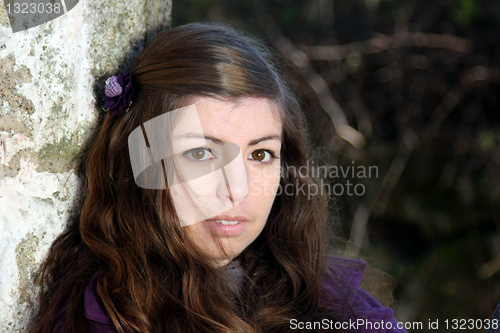 Image of  beautiful woman in an autumn park 