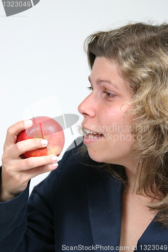 Image of woman with beautiful red apple, healthy food