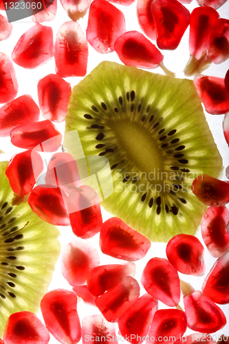 Image of beautiful and fresh pomegranate grains and kiwi