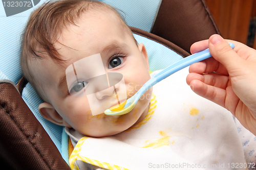 Image of beautiful child eating soup, food child photo