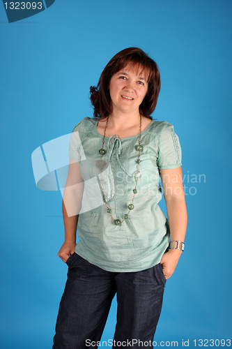 Image of fashion woman on blue background studio shot