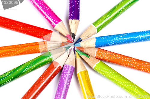 Image of Assortment of coloured pencils with shadow on white background