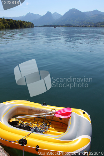 Image of Yellow inflatable boat on mountain lake