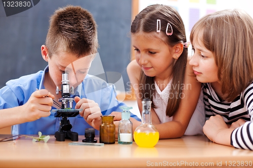 Image of Boy looking into microscope