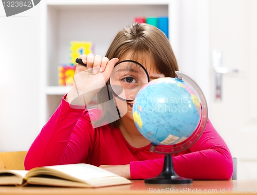 Image of Schoolgirl with loupe