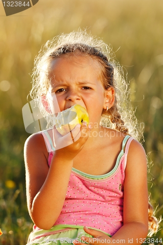 Image of Girl eating an apple