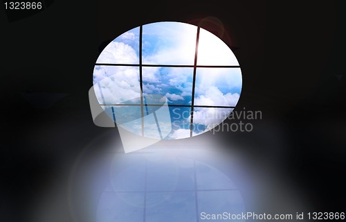 Image of dark room with screens showing a blue sky