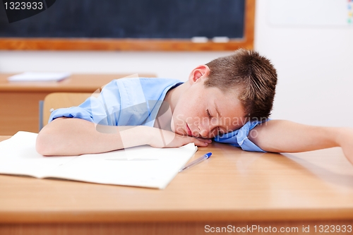 Image of Boy sleeping in classroom