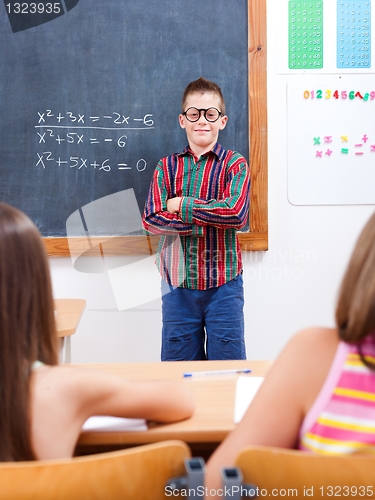 Image of Eminent boy in front of class