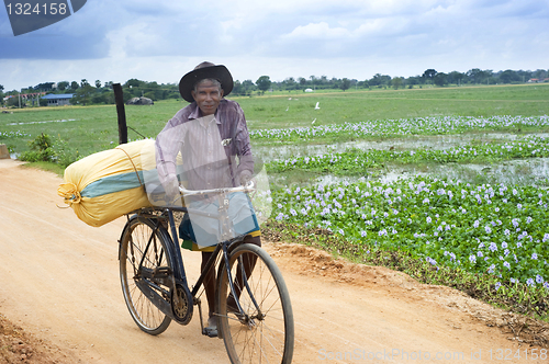 Image of Man with bicycle