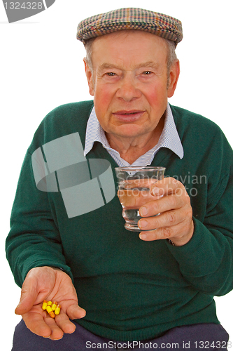 Image of Male senior taking medicine