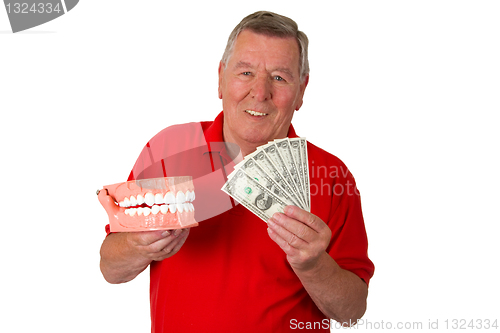 Image of Male senior with teeth modell