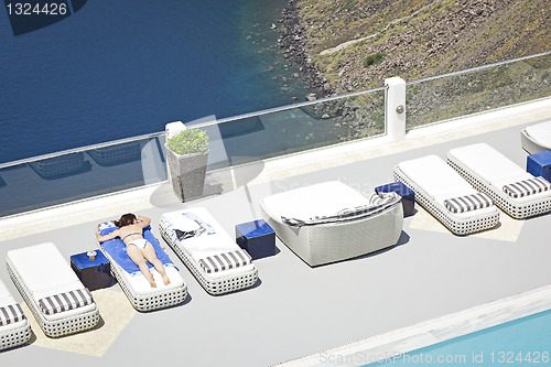 Image of relaxing at the pool