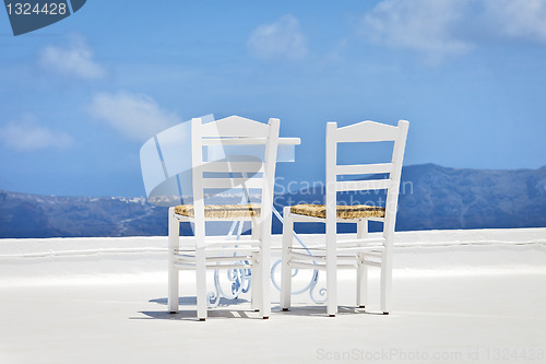 Image of two chairs in the sun