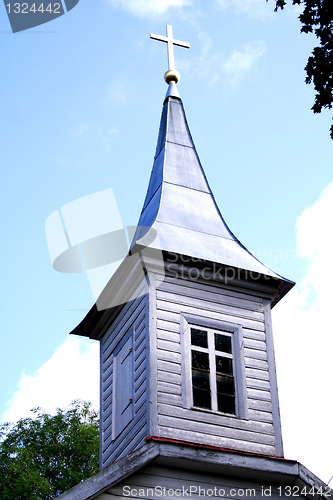 Image of Church tower with lighted cross on roof