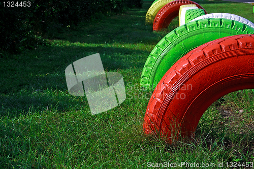 Image of Painted wheels from rubber fixed at playground