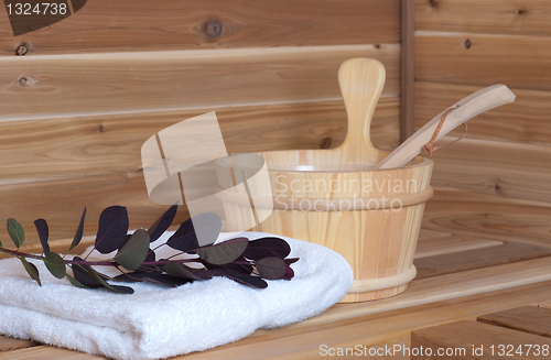 Image of WAter bucket with ladle in sauna