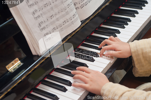 Image of Hands playing piano