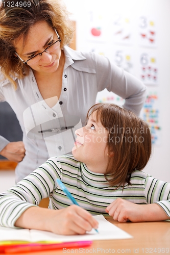 Image of Teacher looking at student