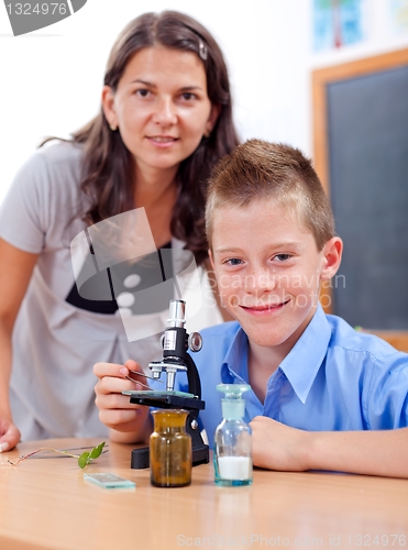 Image of Wise boy with microscope and teacher