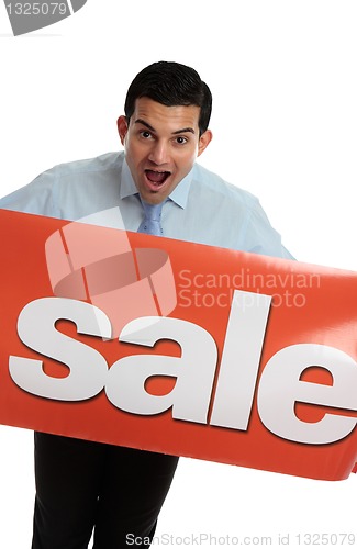 Image of Ecstatic man with SALE sign