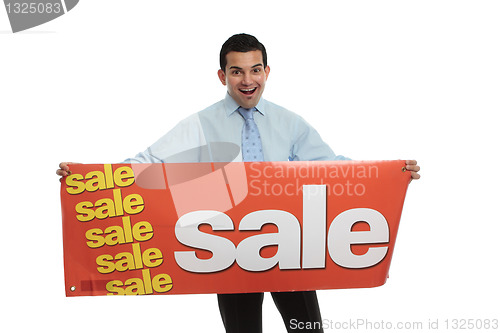 Image of Excited man  holding a Sale sign