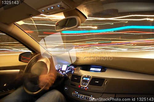 Image of car in motion at night