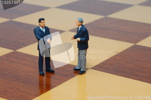 Image of business man on a chess board