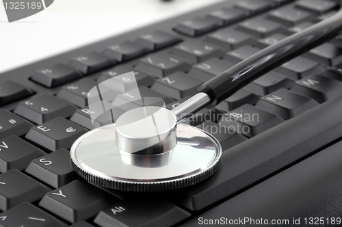 Image of stethoscope on computer keyboard