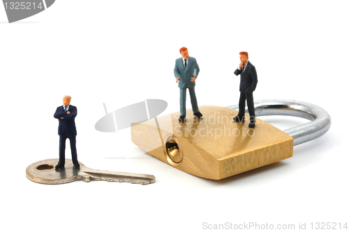 Image of business man on security padlock 