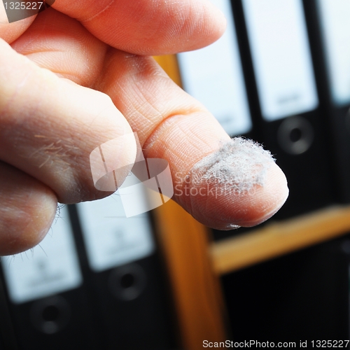 Image of dust and finger