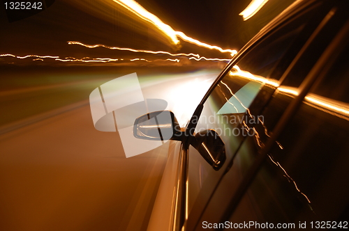 Image of night drive with car in motion 
