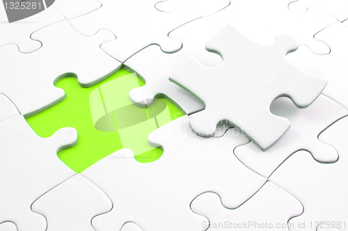 Image of blank puzzle with missing piece