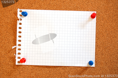 Image of empty sheet paper with push pin