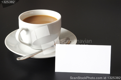 Image of cup of coffee and paper copyspace