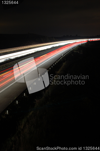 Image of highway at night with traffic